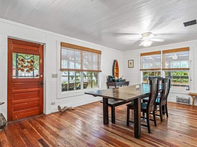 dining room with ceiling fan, wood-type flooring, and ornamental molding