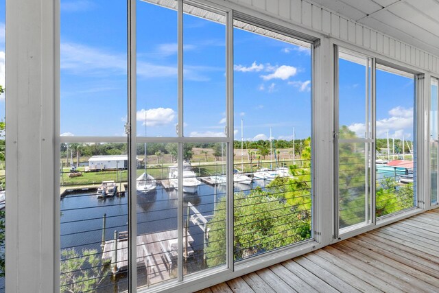 82 Royster Dr, Crawfordville, FL 32327 - unfurnished sunroom with a water view and wood finished floors