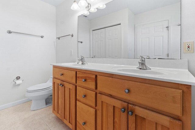 82 Royster Dr, Crawfordville, FL 32327 - full bathroom featuring toilet, tile patterned flooring, double vanity, baseboards, and a chandelier