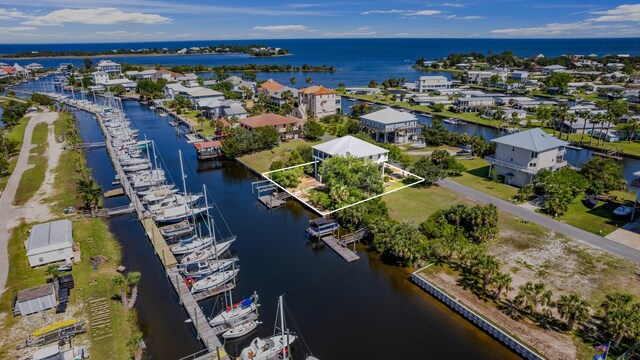 82 Royster Dr, Crawfordville, FL 32327 - aerial view of property and surrounding area featuring a large body of water and property boundaries highlighted