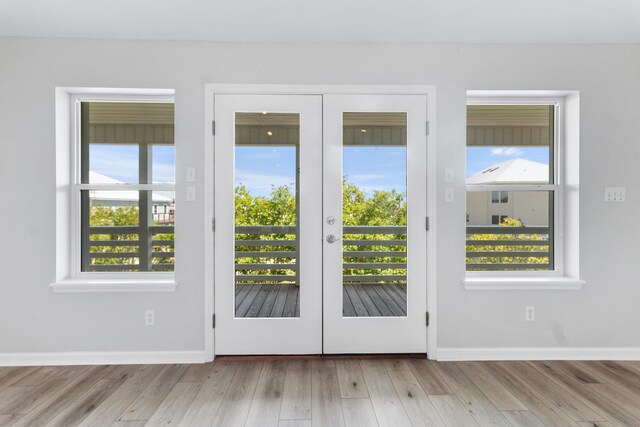 82 Royster Dr, Crawfordville, FL 32327 - doorway featuring french doors, wood finished floors, and baseboards