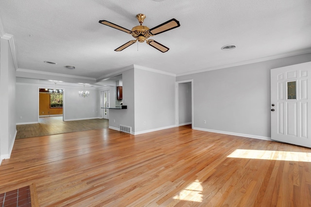 unfurnished living room with ornamental molding, ceiling fan with notable chandelier, a textured ceiling, and light hardwood / wood-style floors