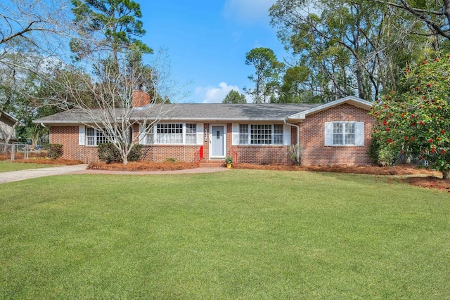 ranch-style house featuring a front lawn