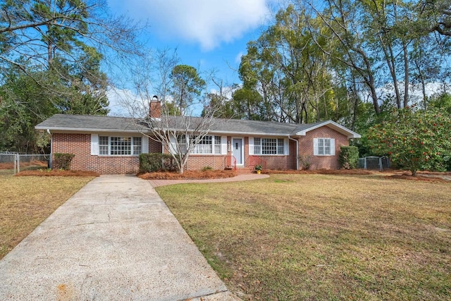 ranch-style house with a front lawn