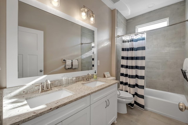 full bathroom featuring toilet, tile patterned flooring, shower / bath combo, and vanity