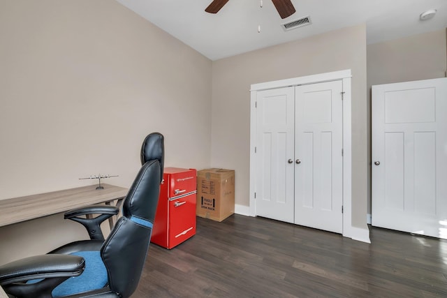 office space featuring ceiling fan and dark hardwood / wood-style floors