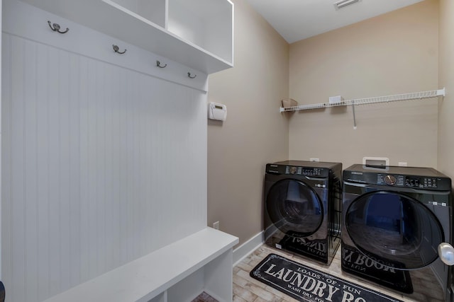 laundry area with separate washer and dryer