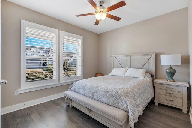 bedroom featuring ceiling fan and dark hardwood / wood-style flooring