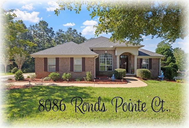 ranch-style house featuring a front lawn