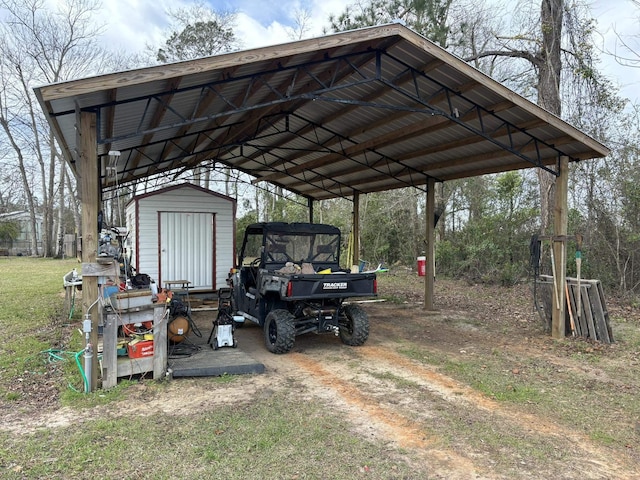322 Graceland Rd, Chattahoochee, FL 32324 - view of vehicle parking featuring a detached carport and a shed