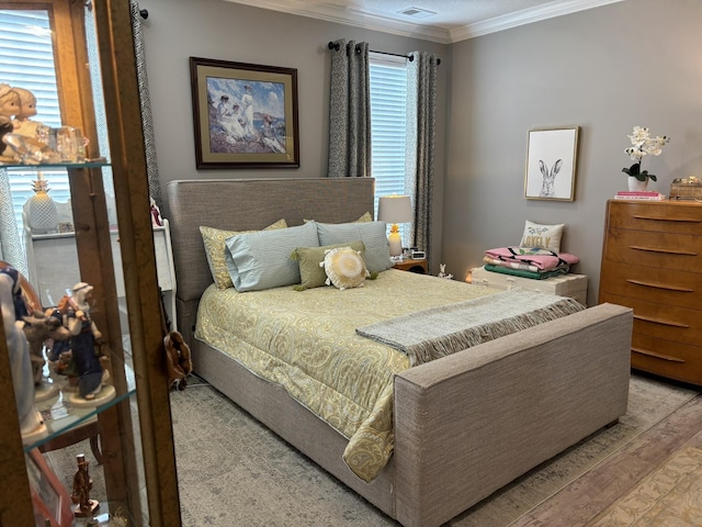 322 Graceland Rd, Chattahoochee, FL 32324 - bedroom featuring visible vents, crown molding, and wood finished floors
