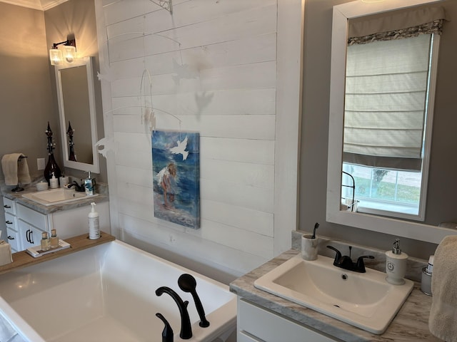 322 Graceland Rd, Chattahoochee, FL 32324 - bathroom featuring two vanities, a bath, and a sink