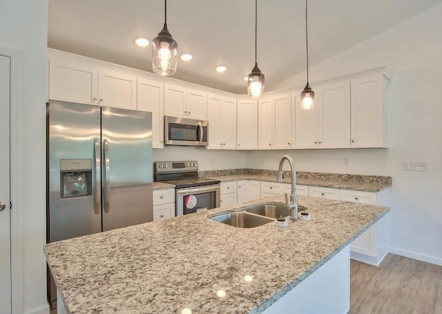 kitchen with white cabinets, appliances with stainless steel finishes, and sink