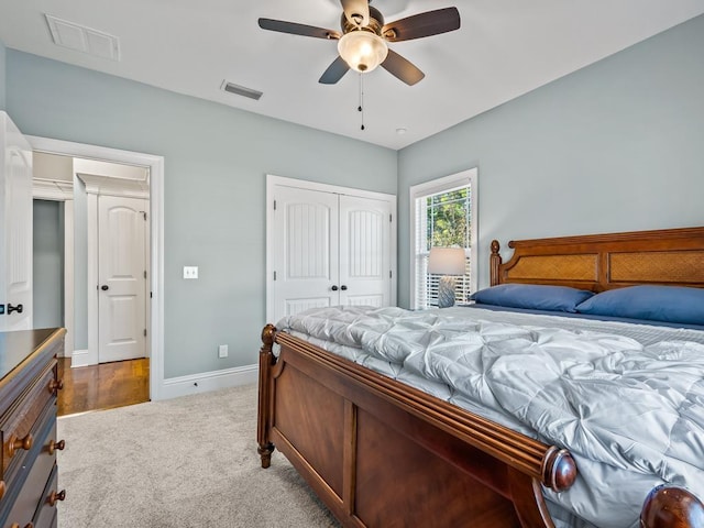 bedroom featuring carpet, ceiling fan, and a closet