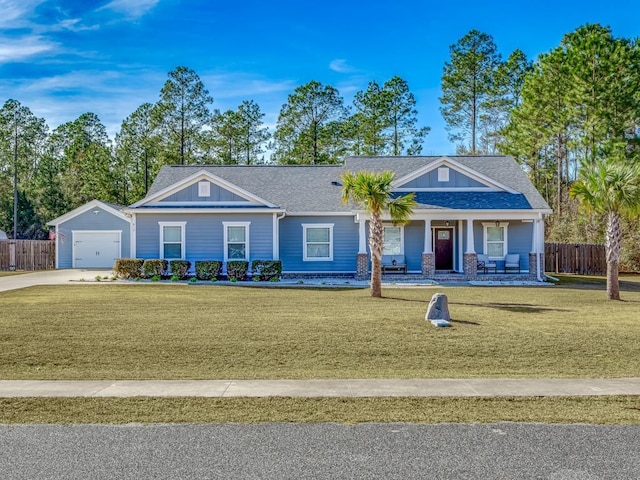 single story home with a garage, covered porch, and a front lawn