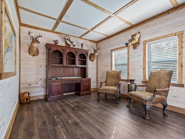 sitting room featuring coffered ceiling, wooden walls, and dark hardwood / wood-style flooring