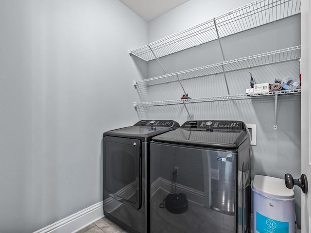 washroom featuring washing machine and clothes dryer