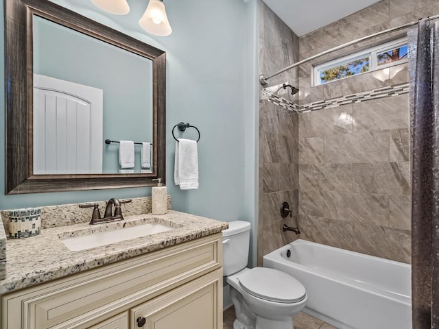 full bathroom featuring vanity, toilet, and shower / tub combo