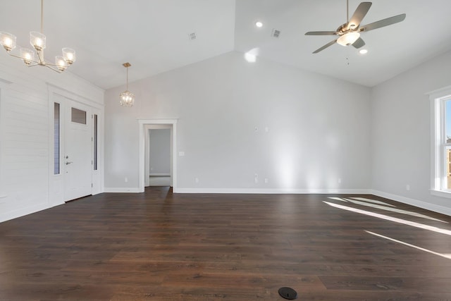 unfurnished room featuring dark wood-type flooring, ceiling fan with notable chandelier, and high vaulted ceiling