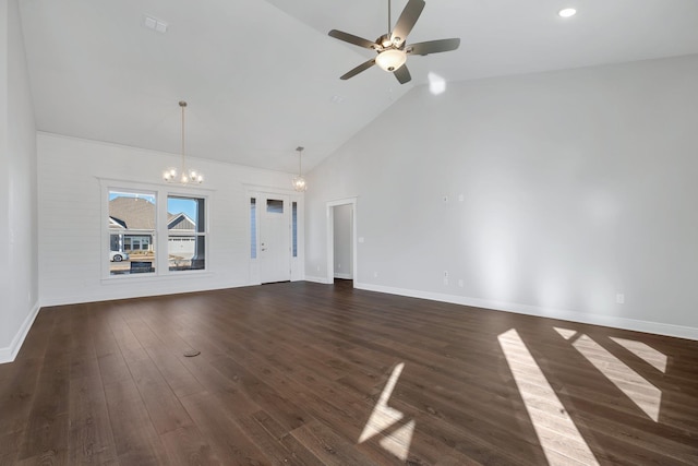 unfurnished living room featuring dark hardwood / wood-style flooring, ceiling fan with notable chandelier, and high vaulted ceiling