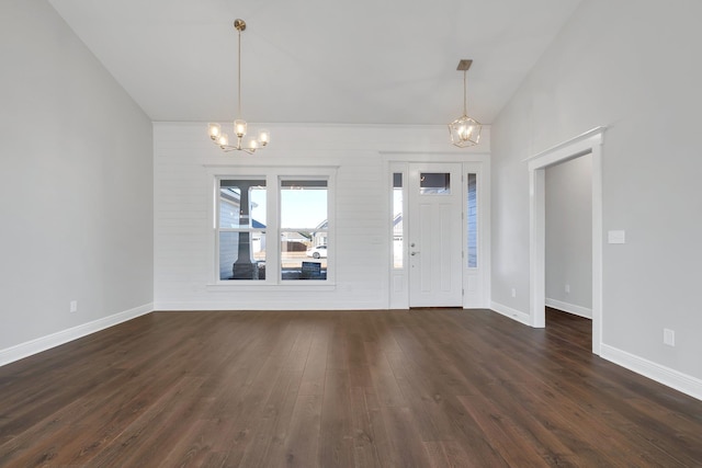 entrance foyer featuring a notable chandelier and dark hardwood / wood-style flooring