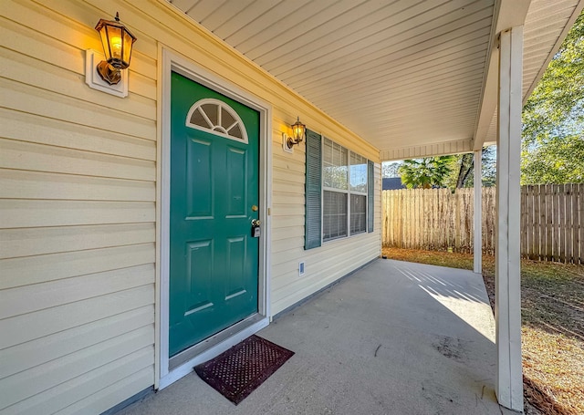 doorway to property featuring covered porch