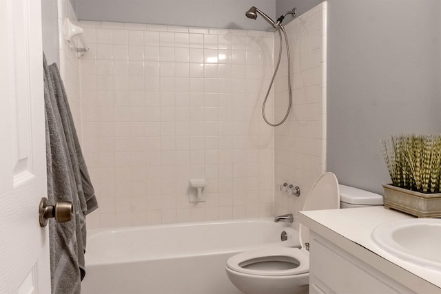 full bathroom with washtub / shower combination, vanity, and toilet