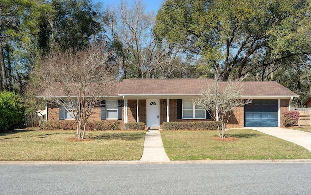 single story home with a garage, driveway, a front lawn, and brick siding