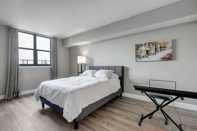 300 S Duval St # 1408, Tallahassee, FL 32301 - bedroom with wood finished floors and baseboards