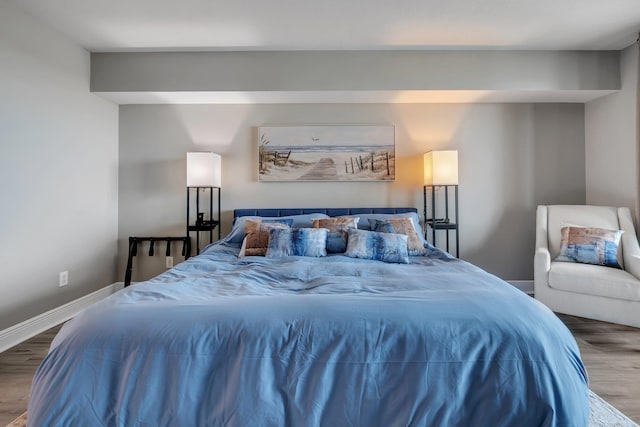 300 S Duval St # 1408, Tallahassee, FL 32301 - bedroom featuring wood finished floors and baseboards
