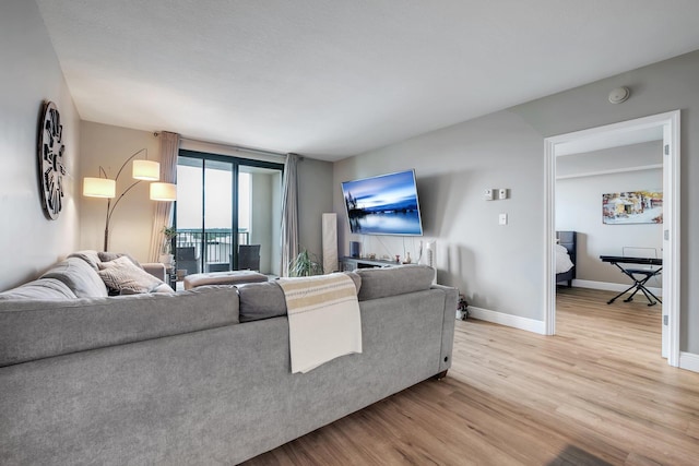 300 S Duval St # 1408, Tallahassee, FL 32301 - living area featuring light wood-style floors and baseboards