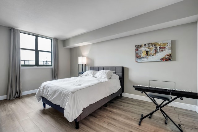 300 S Duval St # 1408, Tallahassee, FL 32301 - bedroom featuring wood finished floors and baseboards