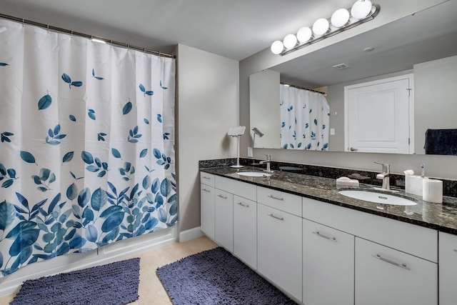 300 S Duval St # 1408, Tallahassee, FL 32301 - full bath with double vanity, tile patterned flooring, and shower / tub combo with curtain