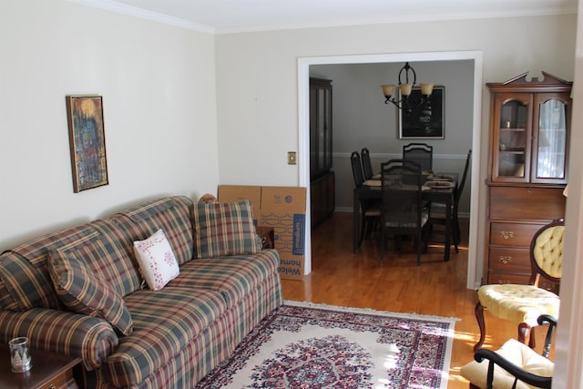1082 Richardson Rd, Tallahassee, FL 32301 - living room featuring wood finished floors, a chandelier, and ornamental molding