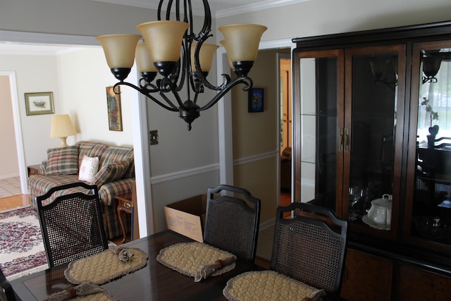 1082 Richardson Rd, Tallahassee, FL 32301 - dining area featuring a chandelier and ornamental molding