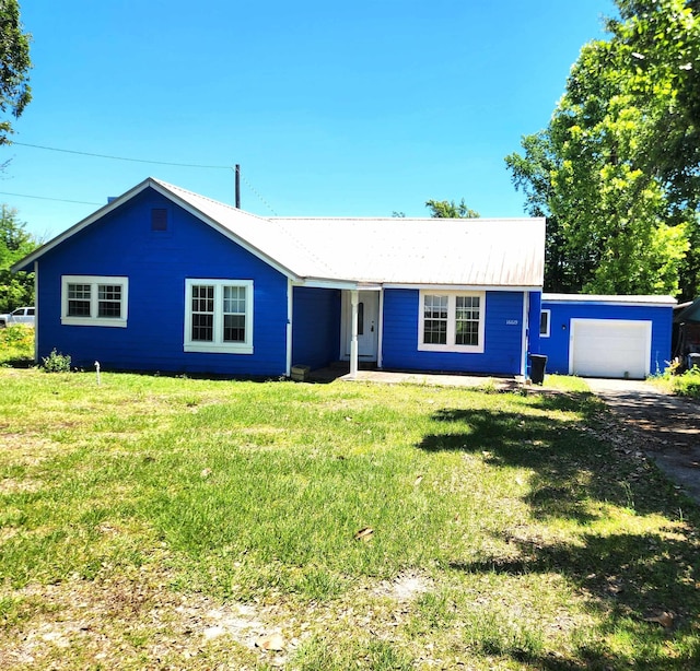 16619 SW Gaskin St, Blountstown, FL 32424 - single story home featuring a front lawn, driveway, a garage, and metal roof
