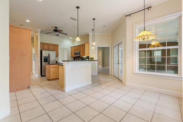 kitchen with hanging light fixtures, ceiling fan, crown molding, and appliances with stainless steel finishes