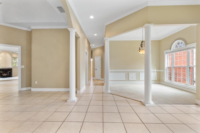 interior space featuring ornate columns and crown molding