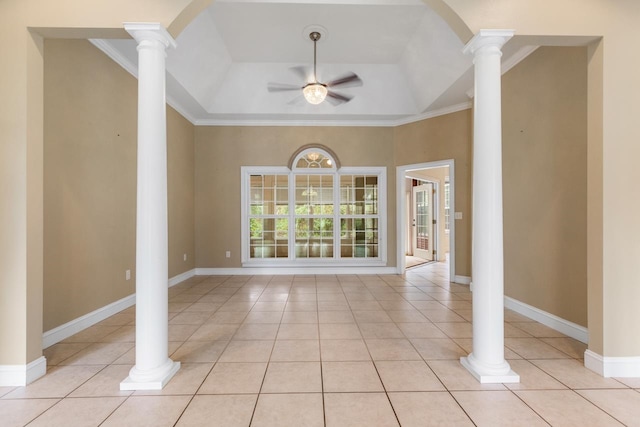 empty room featuring ornate columns, ceiling fan, crown molding, and light tile patterned floors