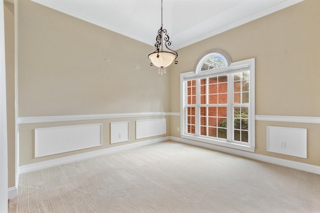 empty room with carpet and crown molding