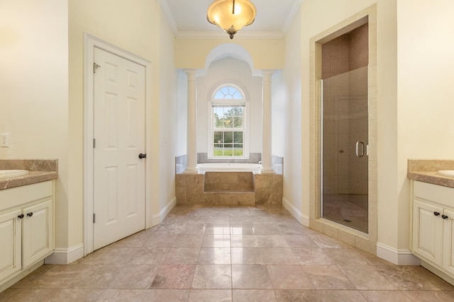 bathroom with vanity, ornamental molding, shower with separate bathtub, and decorative columns