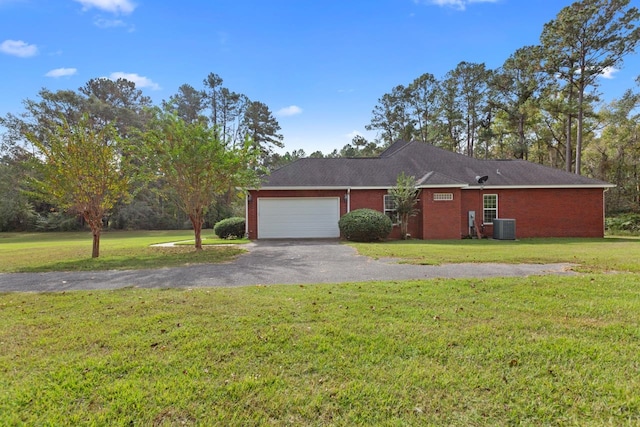 ranch-style house with a garage, central AC, and a front yard