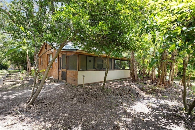 2056 N Sam Poppell Rd, Perry, FL 32347 - view of property exterior with a sunroom
