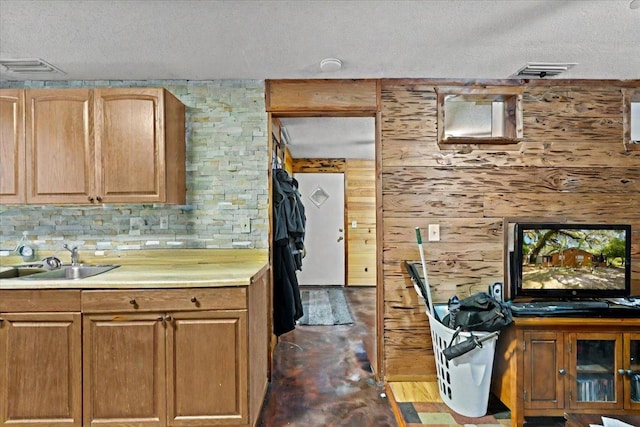 2056 N Sam Poppell Rd, Perry, FL 32347 - kitchen with a textured ceiling, light countertops, and concrete flooring
