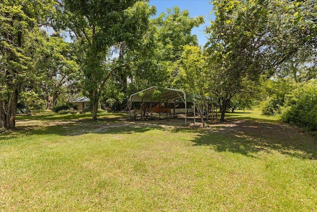 2056 N Sam Poppell Rd, Perry, FL 32347 - view of grassy yard featuring a carport