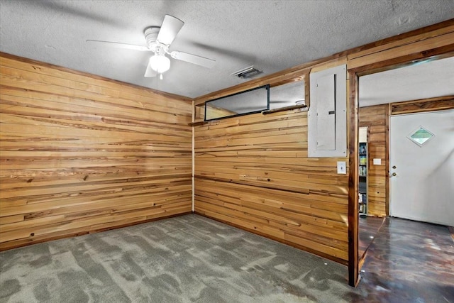 2056 N Sam Poppell Rd, Perry, FL 32347 - below grade area featuring wooden walls, a textured ceiling, and ceiling fan