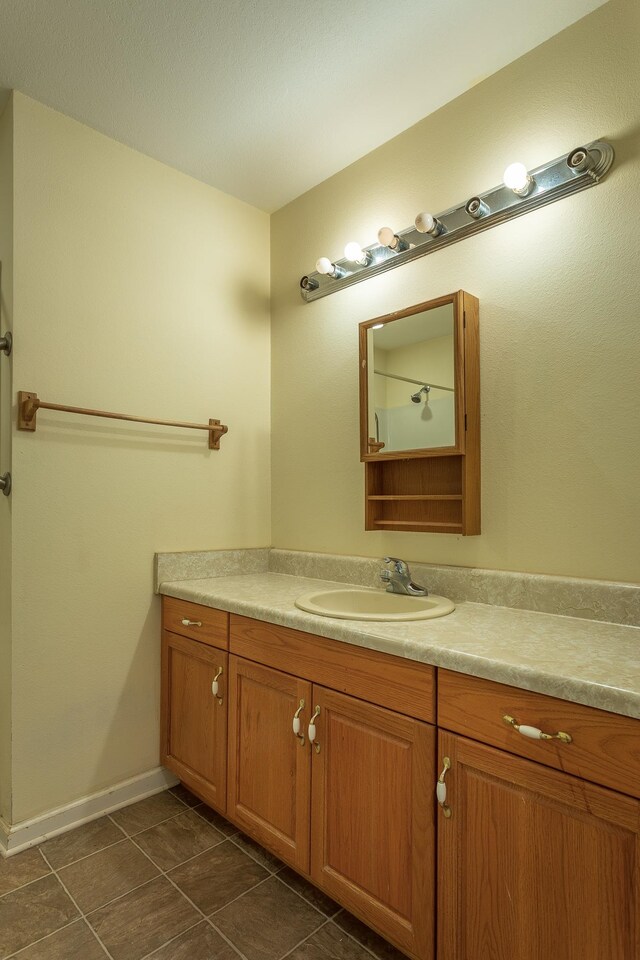 bathroom featuring vanity and tile patterned floors