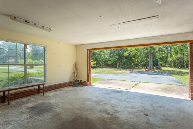 garage featuring a lawn