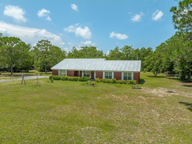 ranch-style house with a front lawn