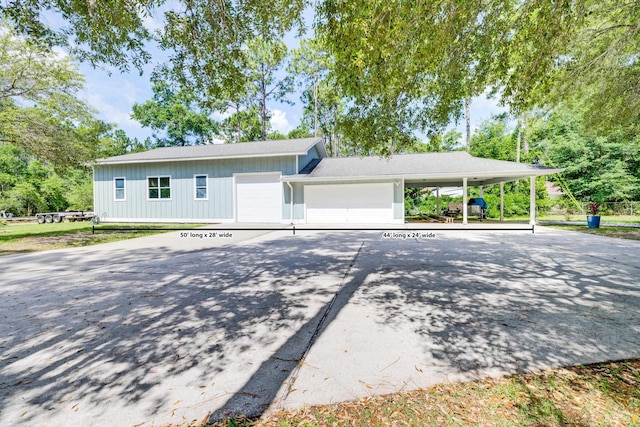 view of front of house with a garage and a carport